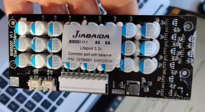 BMS B04S003-L4S-5A 8S 5A active balancer with JiaBaiDa label showing 8S 5A and LiFePO4 3.2V