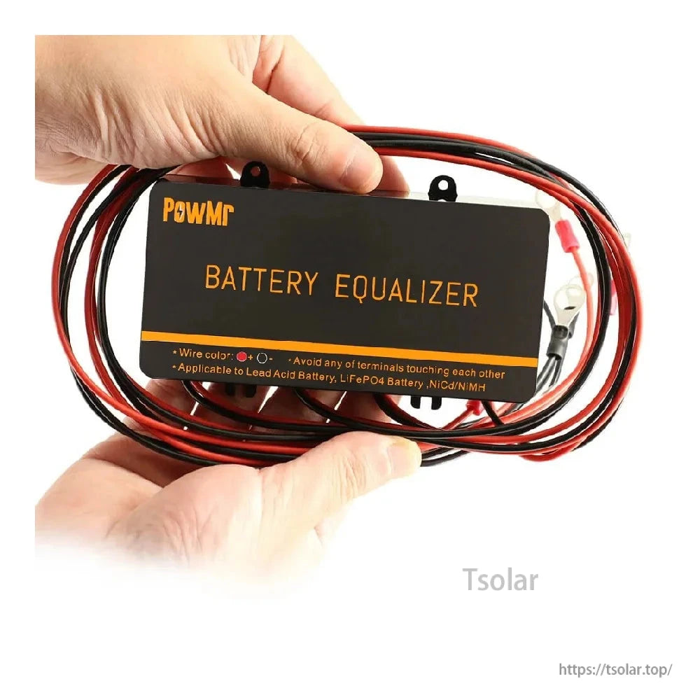 Hand holding battery equalizer with bundled red and black wires and ring terminals