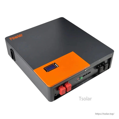 Angled top view highlighting orange cover section and front connection panel with terminals and port cluster
